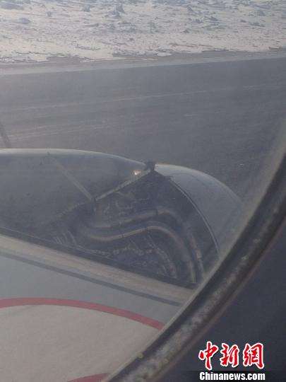 哈尔滨一客机疑发动机外罩脱落返航迫降(图)